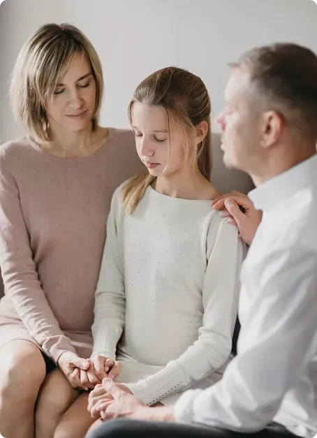 Concerned parent reaching out supportively to teen, representing when to consider professional help for adolescent mental health